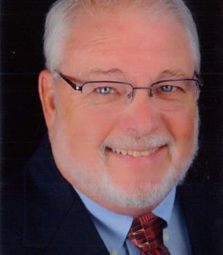 Portrait of Dan Quinn, REALTOR®, CRS, GRI.